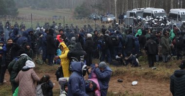 Hundreds of migrants gather at the Belarus side of the border with Poland near Kuznica Bialostocka, Poland, Nov. 9, 2021. (AA Photo)