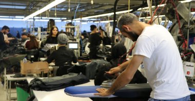 Workers are seen at a textile factory in the southern Adana province, Turkey, Nov. 4, 2021. (AA Photo)