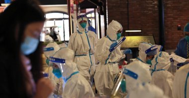 Medical personnel preparing to test visitors at Shanghai Disneyland for COVID-19, Shanghai, China, Oct. 31, 2021.