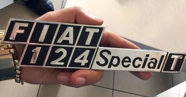 An original badge for the "Fiat 124 Special T" used in Paşam Sezer's restoration of his Tofaş Murat 124, Istanbul, Turkey, Nov. 8, 2021. (Sabah Photo)