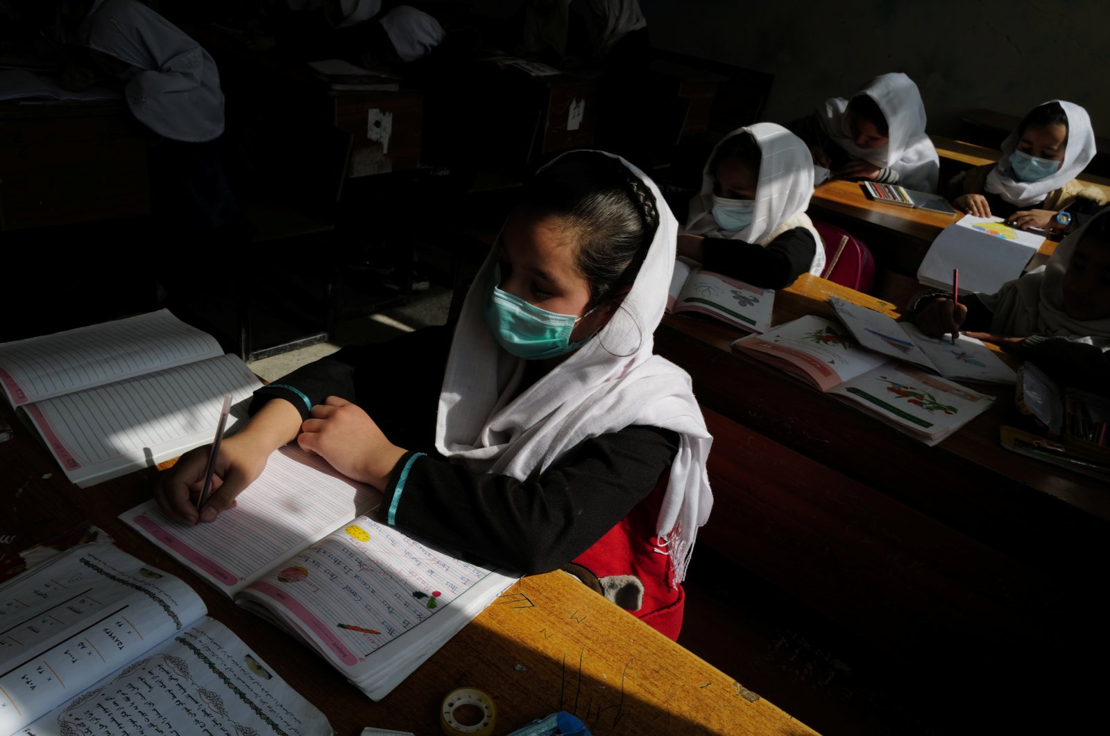 Hadia, 10, a fourth grade primary school student attends class in Kabul, Afghanistan, Oct. 25, 2021. (Reuters Photo)