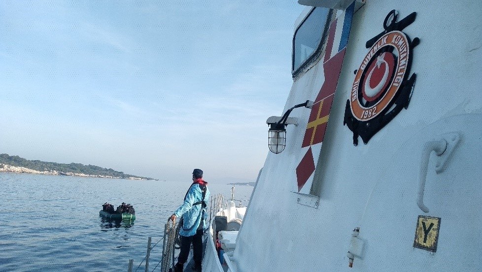 A Turkish Coast Guard Command unit approaches a migrant boat off western İzmir province, Turkey, Nov. 9, 2021. (İHA Photo)
