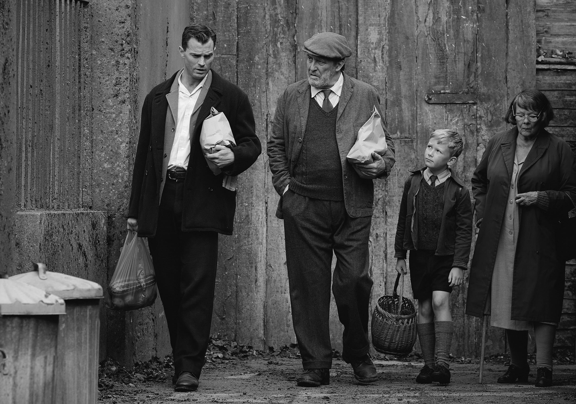 Jamie Dornan (L), Ciaran Hinds (C-L), Jude Hill (C-R) and Judi Dench, in a scene from the film “Belfast.” (Focus Features via AP)