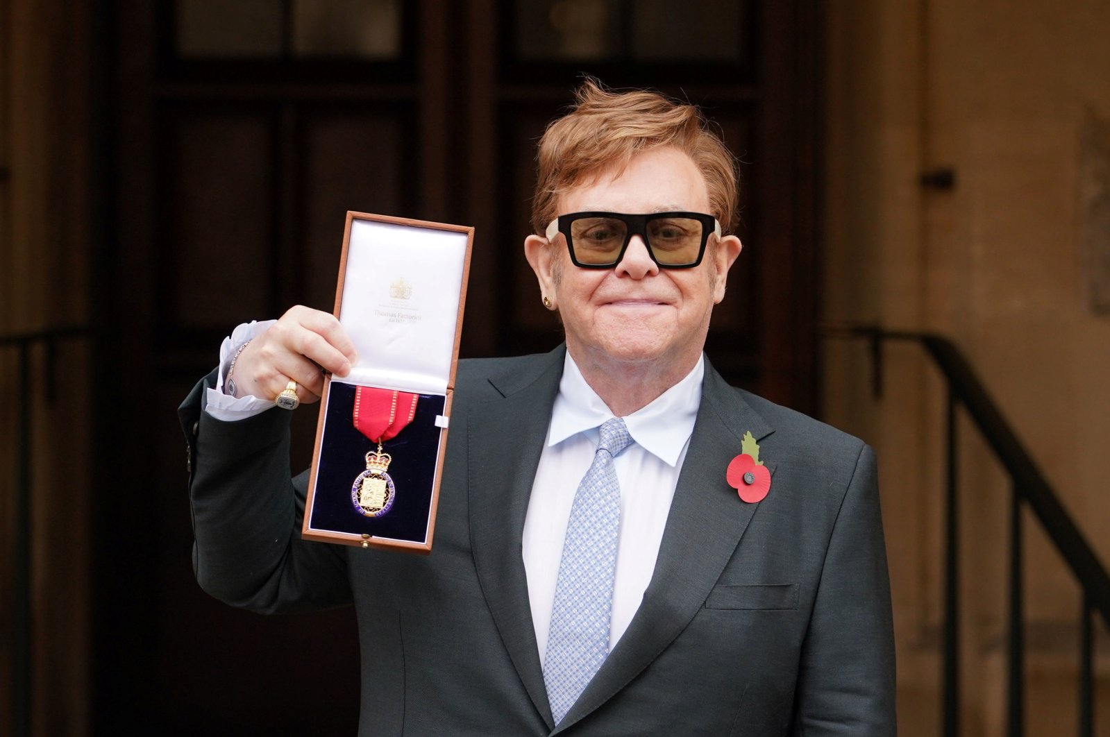 Musician Elton John poses after being made a member of the Order of the Companions of Honour during an investiture ceremony at Windsor Castle in Windsor, Britain, Nov. 10, 2021. (REUTERS)