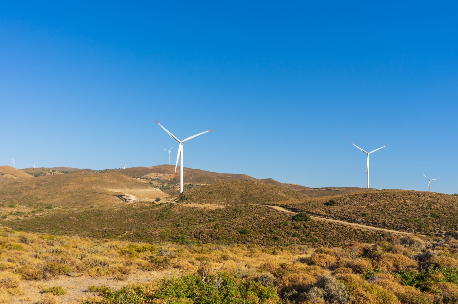 Wind turbines in the mountains in Karaburun district of İzmir, western Turkey, Aug. 7, 2021. (Shutterstock Photo)