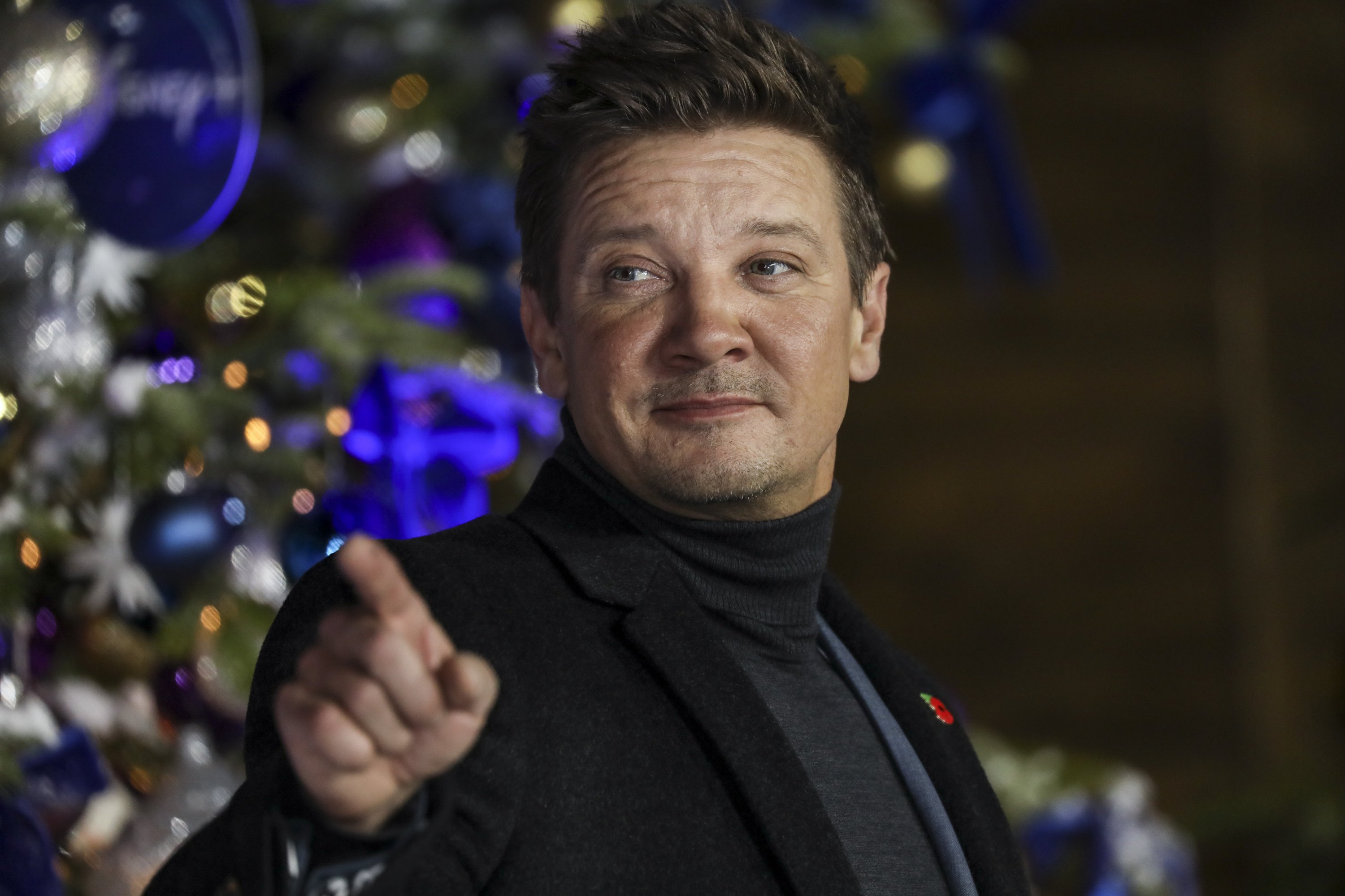 Jeremy Renner poses for photographers upon arrival at the U.K. Fan Screening of the film 'Hawkeye' in London, Nov. 11, 2021. (AP)