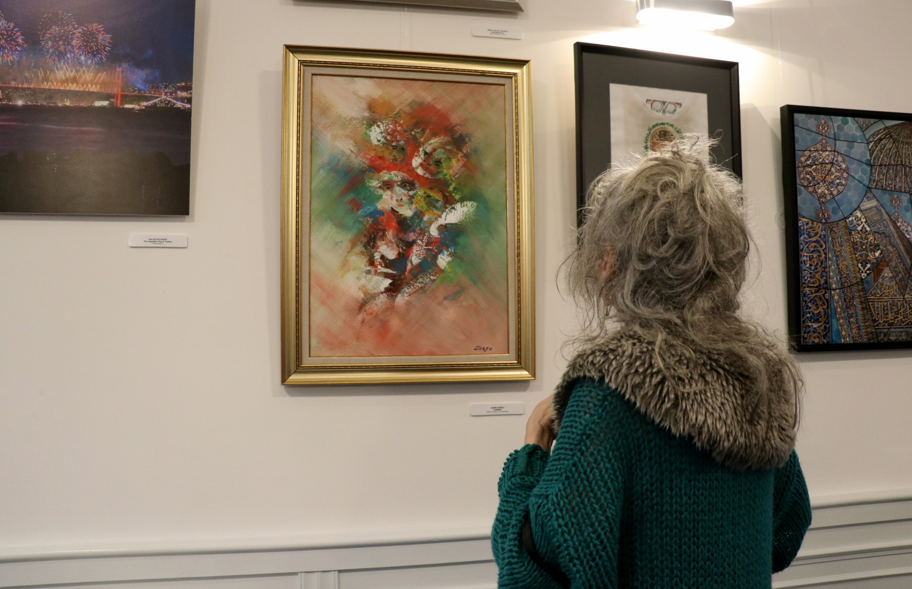 A visitor examines works at the “Sepharad – Traces of a Multicultural Heritage,” YEE Amsterdam, Nov. 12, 2021. (AA Photo)