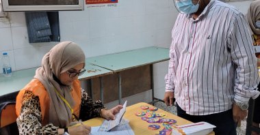 A Libyan man registers to vote at a polling station in Tripoli, Libya, Nov. 8, 2021. (AFP Photo)