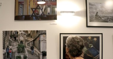 A visitor examines works at the “Sepharad – Traces of a Multicultural Heritage,” YEE Amsterdam, Nov. 12, 2021. (AA Photo)