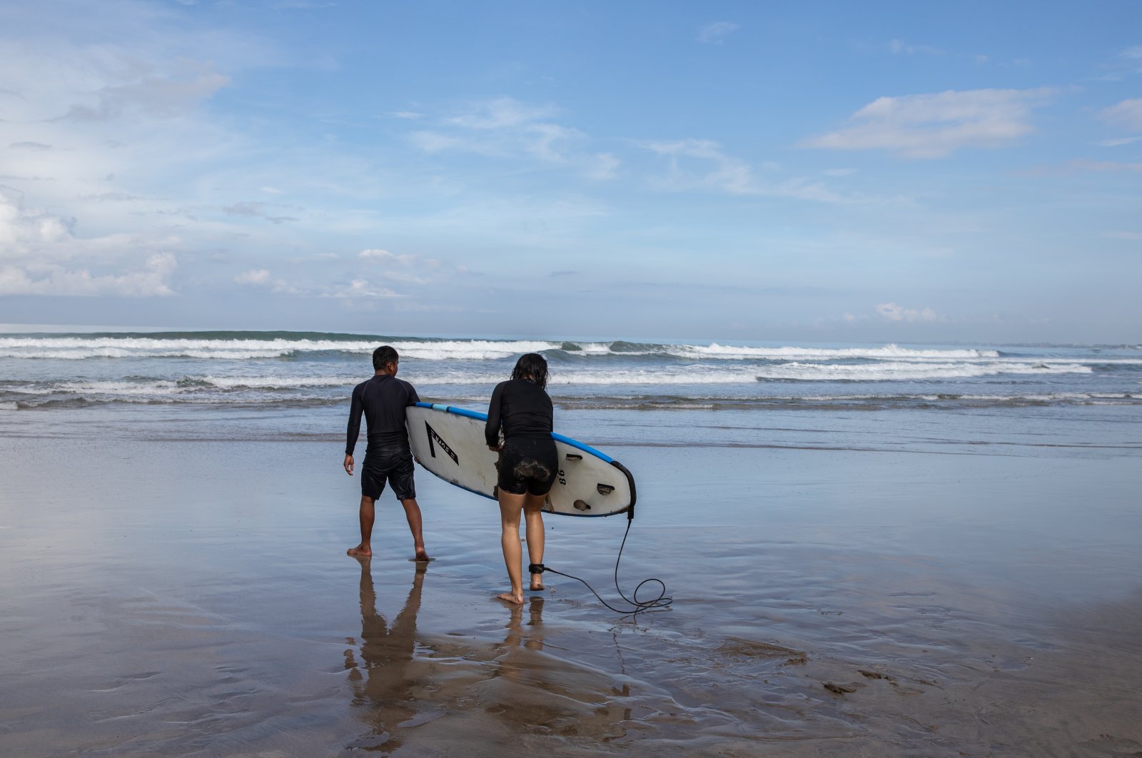 People learn to surf at the beach in the Kuta area of Bali, Indonesia, Oct. 29, 2021. (Bloomberg via Getty Images) 