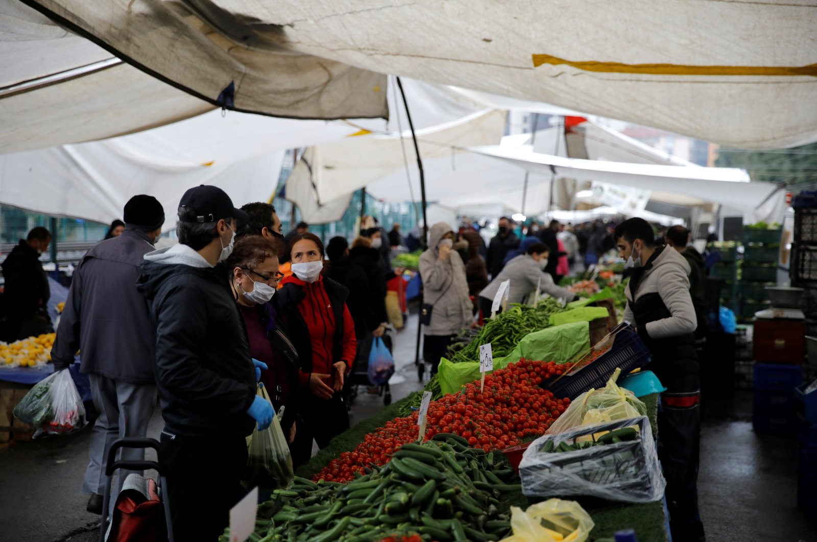 People buy fruit and vegetables in an open market in Istanbul, Turkey, May 4, 2020. (Reuters Photo)