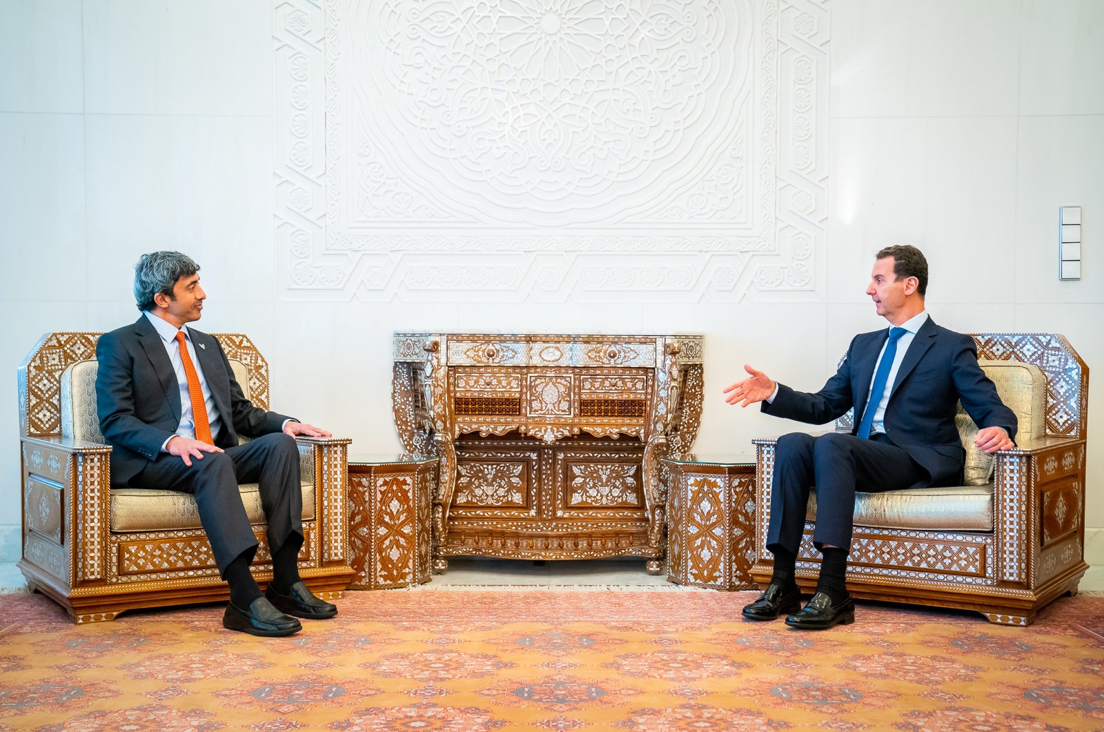 A handout photo made available by Emirates News Agency (WAM) shows United Arab Emirates Minister of Foreign Affairs and International Co-operation Sheikh Abdullah bin Zayed bin Sultan Al Nahyan (L) talking with Syria's Bashar Assad during his visit to Damascus, Syria, 09 November 2021. (EPA Photo)
