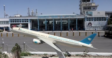 A model of an Ariana Afghan Airlines jet is seen in front of the international airport in Kabul, Afghanistan, Sept. 5, 2021. (WANA via Reuters)