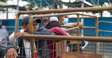 Relatives of prisoners await information about their loved ones, outside a penitentiary in Guayaquil, Ecuador, Nov. 13, 2021. (EPA Photo)