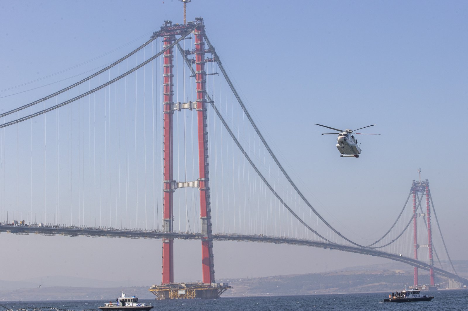 A helicopter carrying President Recep Tayyip Erdoğan flies near the 1915 Çanakkale Bridge before a ceremony, in Çanakkale, nothwestern Turkey, on Nov. 13, 2021. (AA Photo)