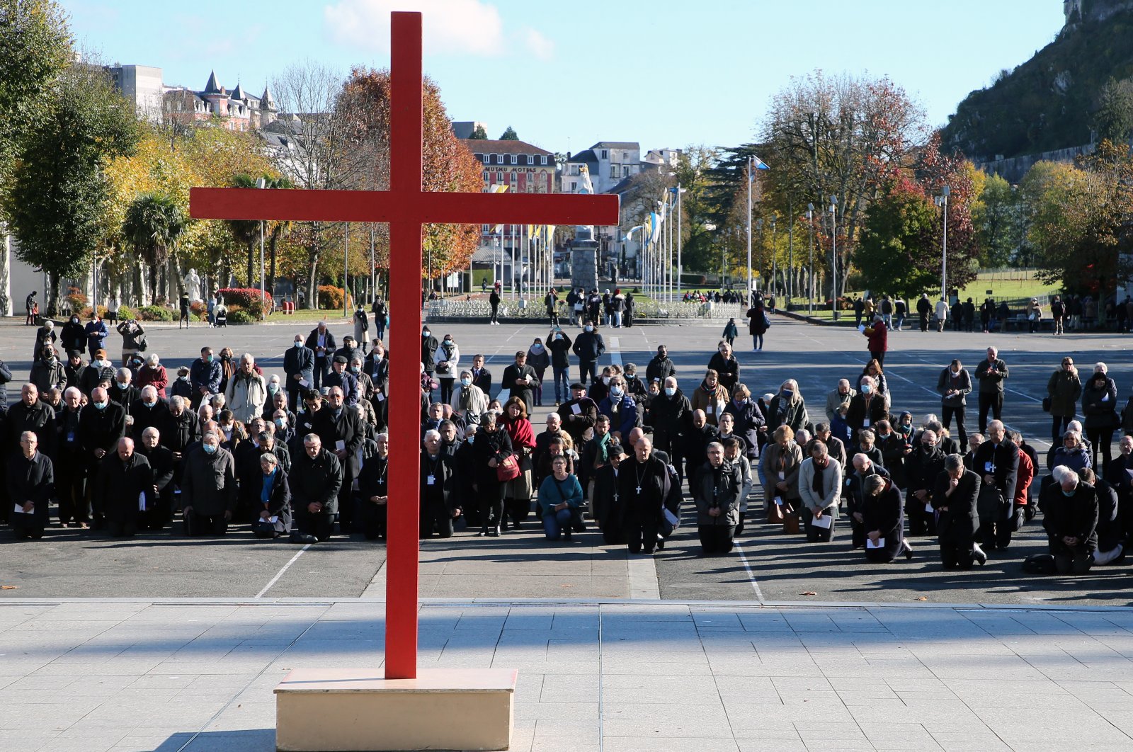 Bishops gesture on the forecourt of the Notre-Dame-du-Rosaire basilica in the sanctuary of Lourdes, southwestern France, Saturday, Nov. 6, 2021 during a ceremony, part of The Bishops' Conference, the first after a commission revealed the level of sex abuse within the Roman Catholic church in France. (AP Photo)