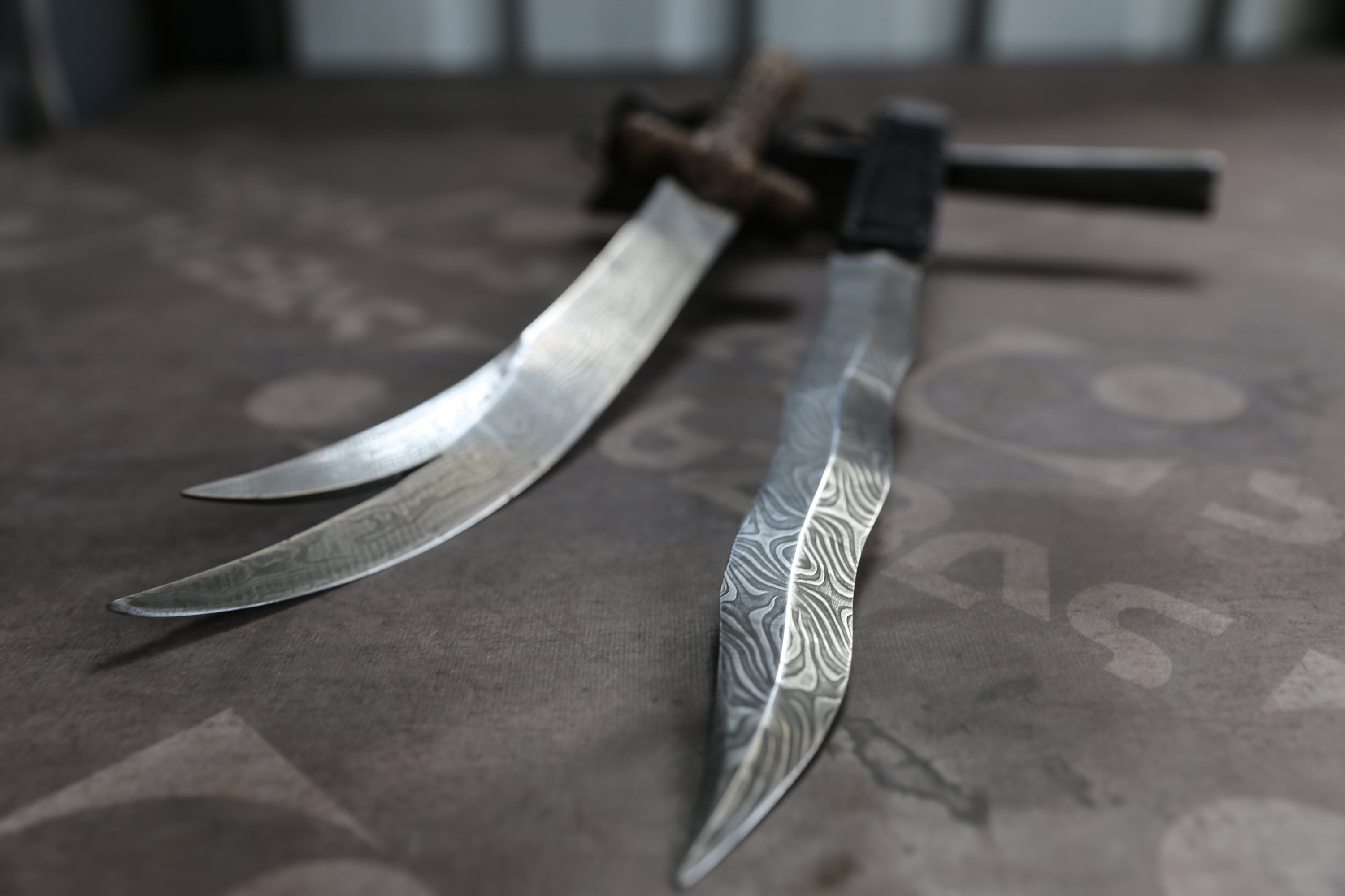 Handmade Damascus steel weapons by metalsmith Yusuf Bayyiğit shown in his workshop in Malatya, Turkey, Nov. 9, 2021. (AA Photo)