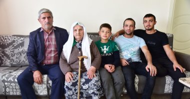 An Ahıska Turkish family poses for a photo in their home in eastern Bitlis province, Turkey, Nov. 14, 2021. (IHA Photo)