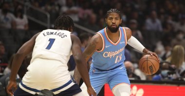Los Angeles Clippers forward Paul George (R) dribbles the ball against Minnesota Timberwolves guard Anthony Edwards during the first half at Staples Center, Los Angeles, California, U.S., Nov 13, 2021. (Reuters Photo)