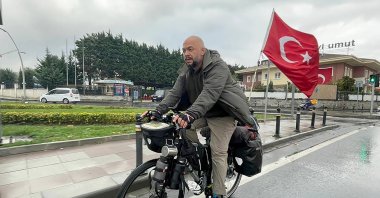 Cyclist Recai Karaca Pak is seen on his bike on the streets of Turkey, Nov. 12, 2021 (AA Photo)