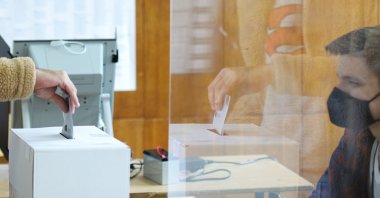 A person casts vote at a polling station, during parliamentary and presidential elections, in Sofia, Bulgaria, Nov.14, 2021. (Reuters Photo)