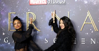 Director Chloe Zhao (R) and cast member Lauren Ridloff pose as they arrive for a screening of the film "Eternals" in London, U.K., Oct. 27, 2021. (Reuters Photo)