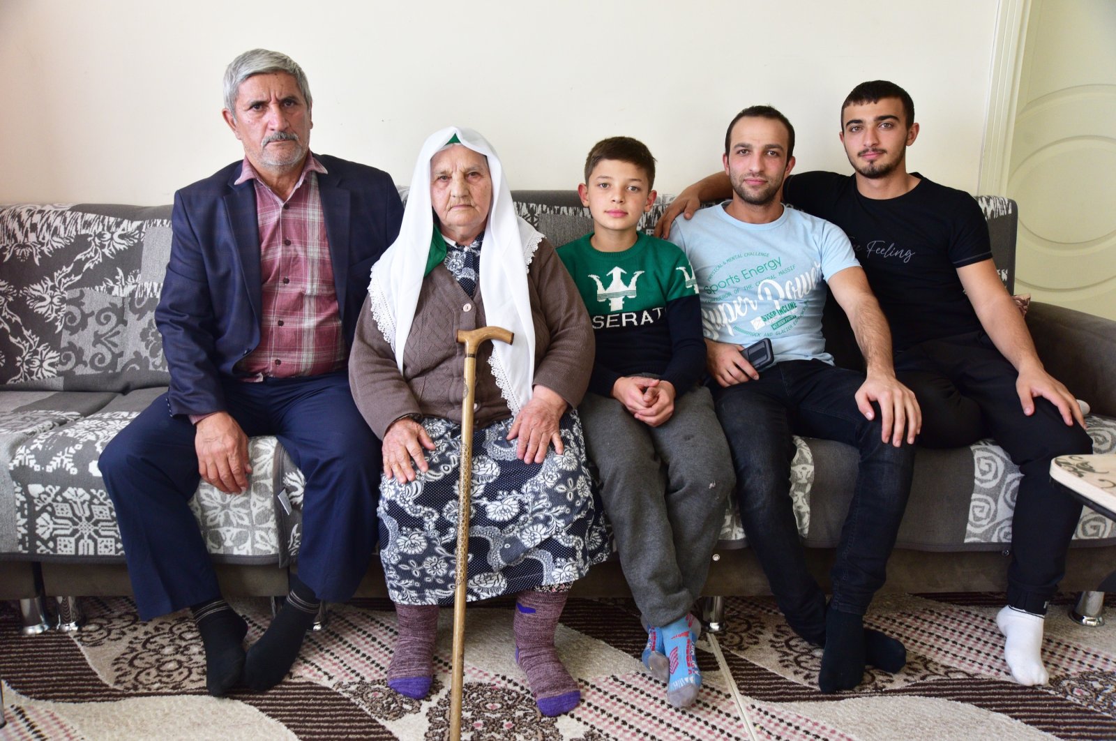 An Ahıska Turkish family poses for a photo in their home in eastern Bitlis province, Turkey, Nov. 14, 2021. (IHA Photo)
