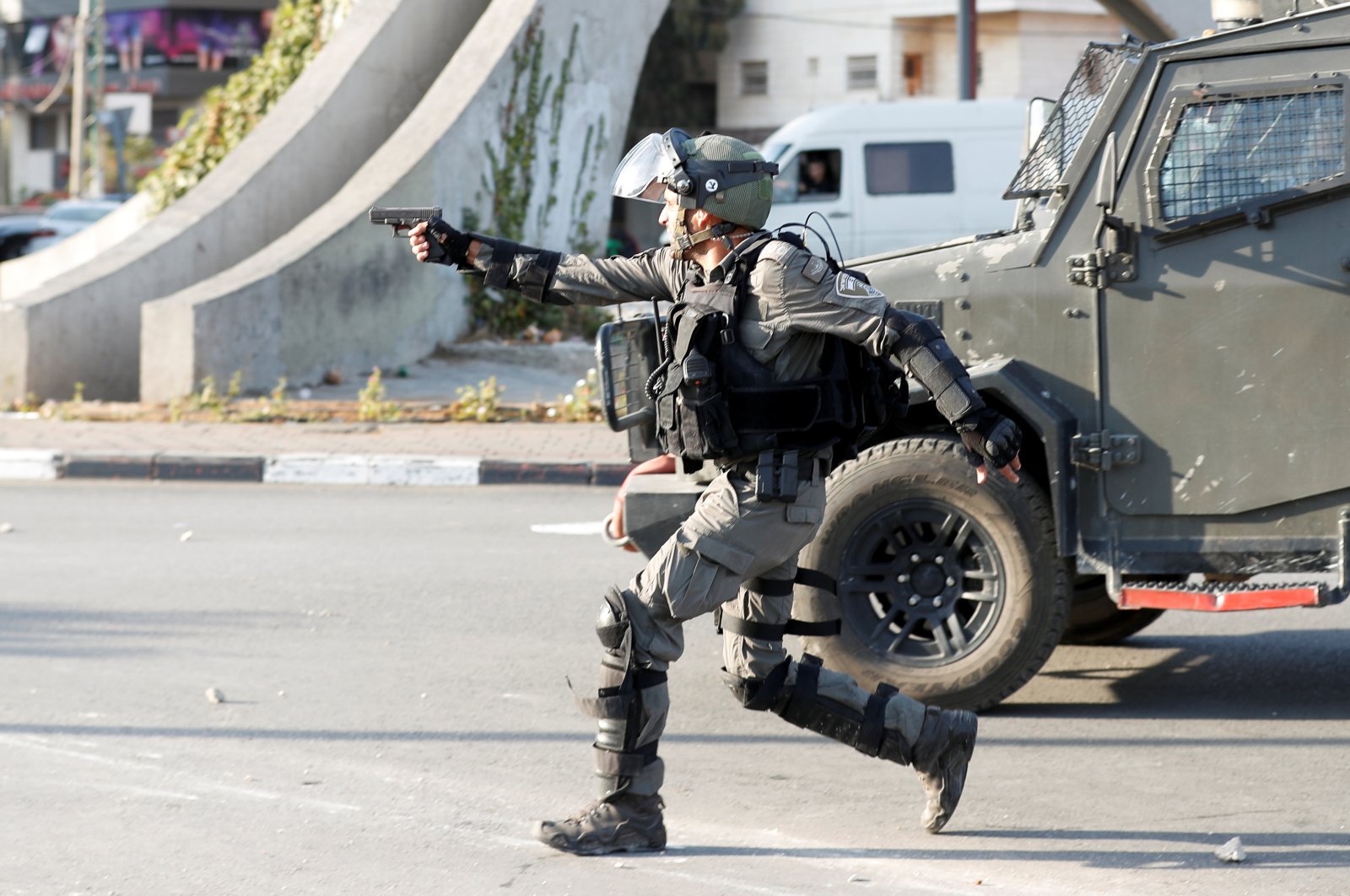 A member of the Israeli forces aims with a gun during a protest near the Jewish settlement of Beit El, near Ramallah, in the Israeli-occupied West Bank, Nov. 11, 2021. (Reuters Photo)