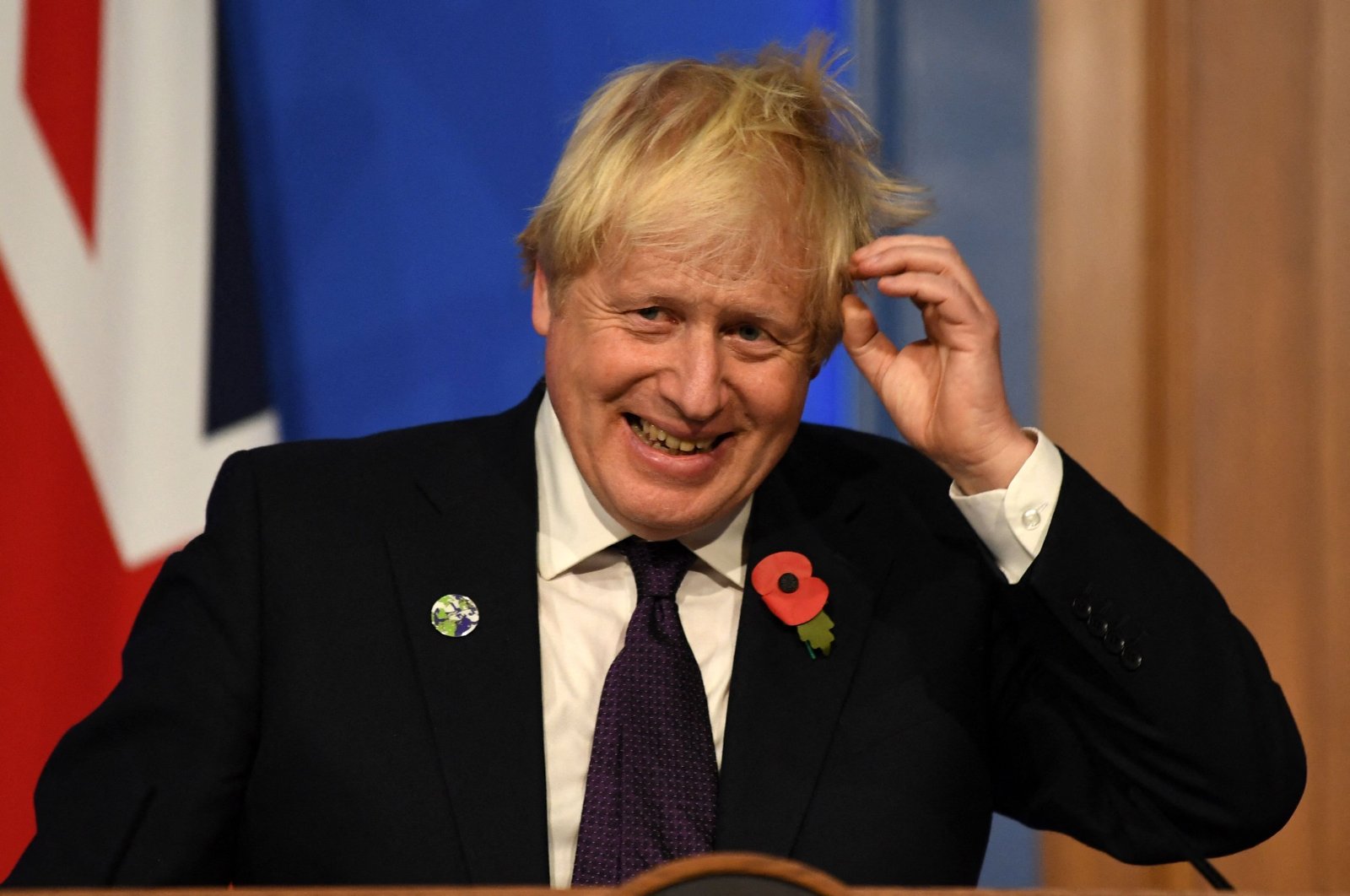 Britain's Prime Minister Boris Johnson smiles during a press conference inside the Downing Street Briefing Room in central London, U.K., Nov. 14, 2021. (AFP Photo)