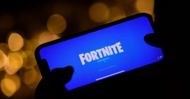 This file illustration picture shows a person logging into Epic Games' Fortnite on their smartphone in Los Angeles, U.S., Aug. 14, 2020  (AFP Photo)