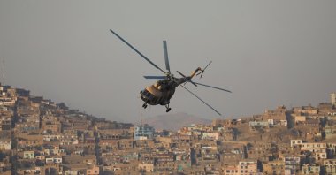 A military helicopter is pictured during the Taliban military parade in Kabul, Afghanistan, Nov. 14, 2021. (Reuters Photo)