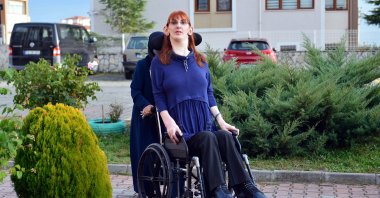 Rümeysa Gelgi, the world's tallest woman, is pushed in her wheelchair by her mother, in Karabük, northern Turkey, Nov. 15, 2021. (AA PHOTO)