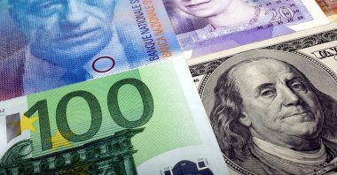 A picture illustration of the U.S. dollar, Swiss Franc, British pound and Euro banknotes, taken in Warsaw, Poland, Jan. 26, 2011. (Reuters Photo)