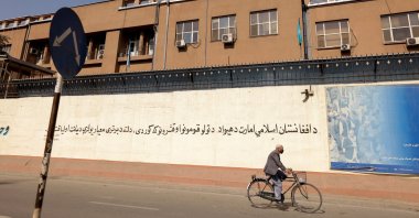 A man rides a bike in front of the Bank of Afghanistan in Kabul, Afghanistan, Oct. 8, 2021. (Reuters File Photo)