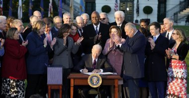 U.S. President Joe Biden signs the "Infrastructure Investment and Jobs Act" during an event on the South Lawn of the White House, in Washington, U.S., Nov. 15, 2021. (AP Photo)