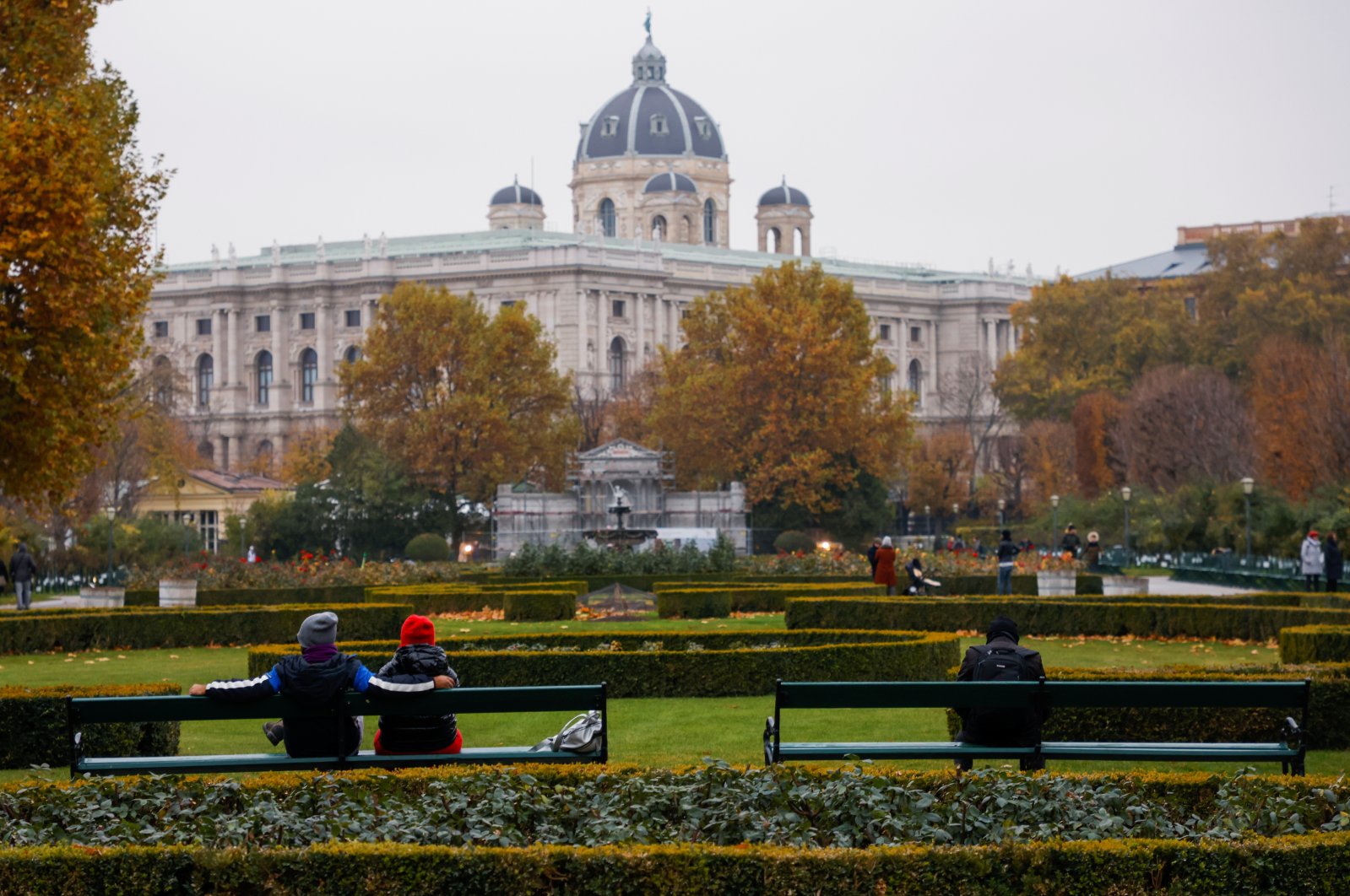 People sit in a public garden amidst the coronavirus outbreak, as Austria&#039;s government imposes a lockdown on people who are not fully vaccinated, in Vienna, Austria, Nov. 14, 2021. (Reuters Photo)