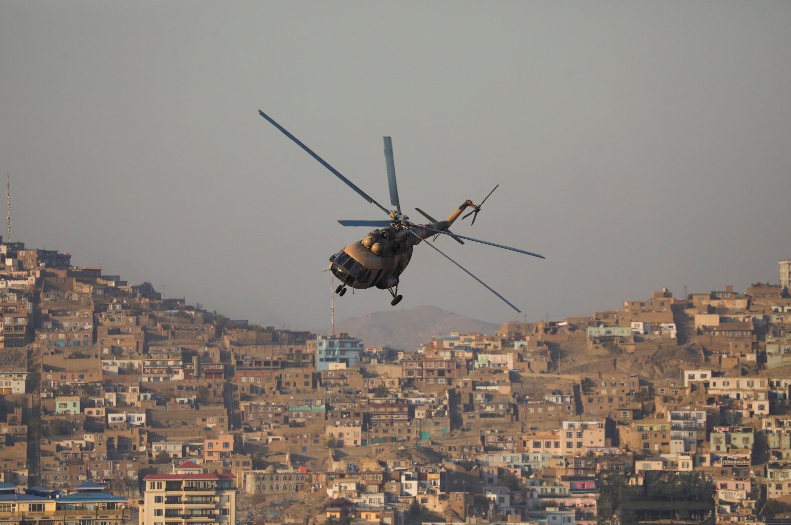 A military helicopter is pictured during the Taliban military parade in Kabul, Afghanistan, Nov. 14, 2021. (Reuters Photo)