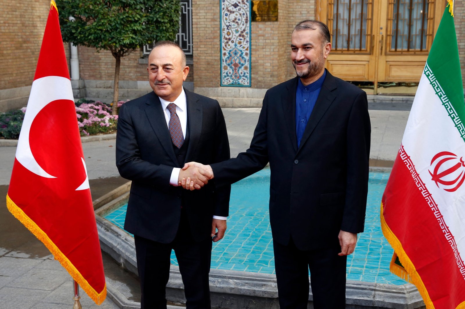 Iran&#039;s Foreign Minister Hossein Amir-Abdollahian (R) welcomes his Turkish counterpart Mevlüt Çavuşoğlu in the capital Tehran, Iran, Nov. 15, 2021. (AFP Photo)