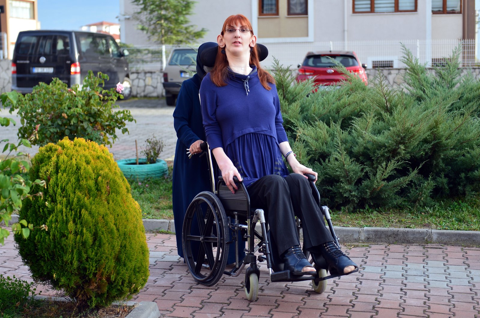 Rümeysa Gelgi, the world&#039;s tallest woman, is pushed in her wheelchair by her mother, in Karabük, northern Turkey, Nov. 15, 2021. (AA PHOTO)