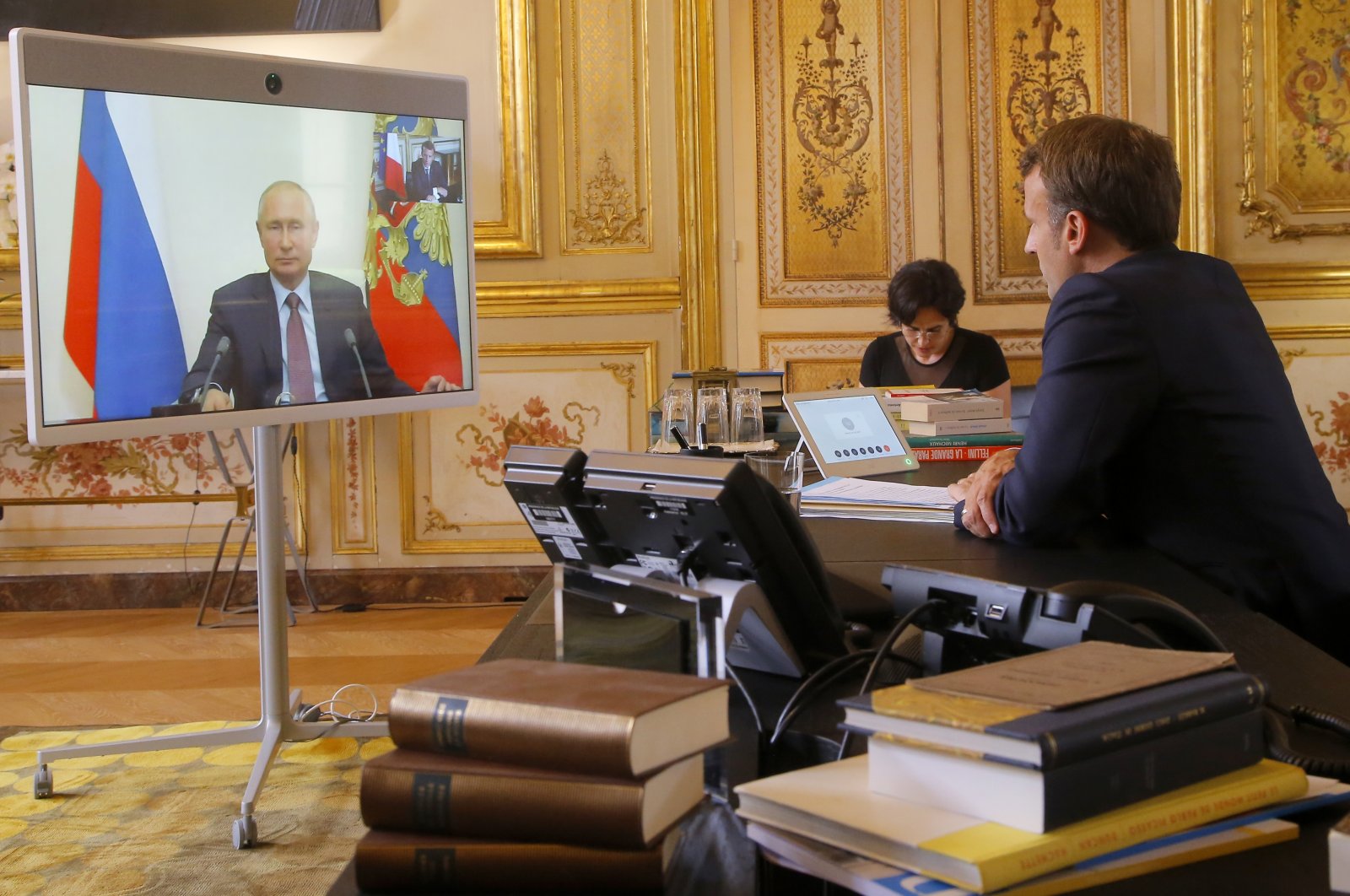 French President Emmanuel Macron talks to Russian President Vladimir Putin during a video conference at the Elysee Palace in Paris, France, June 26, 2020. (AP File Photo)