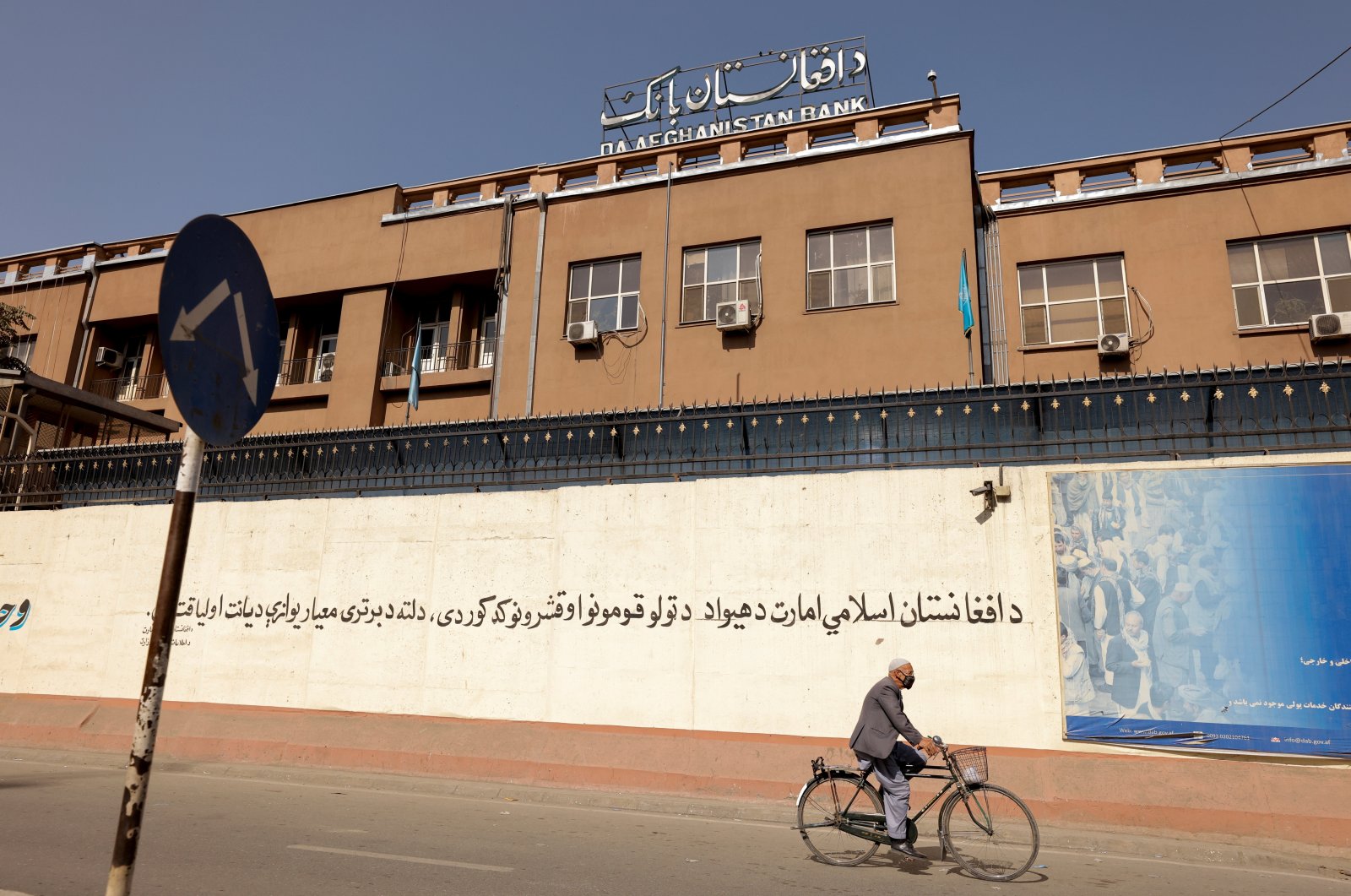 A man rides a bike in front of the Bank of Afghanistan in Kabul, Afghanistan, Oct. 8, 2021. (Reuters File Photo)