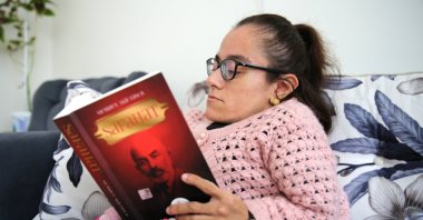 Tuğba Fidan, who has brittle bone disease, spends most of her time reading books, Sivas, Turkey, Nov. 16, 2021. (AA photo)