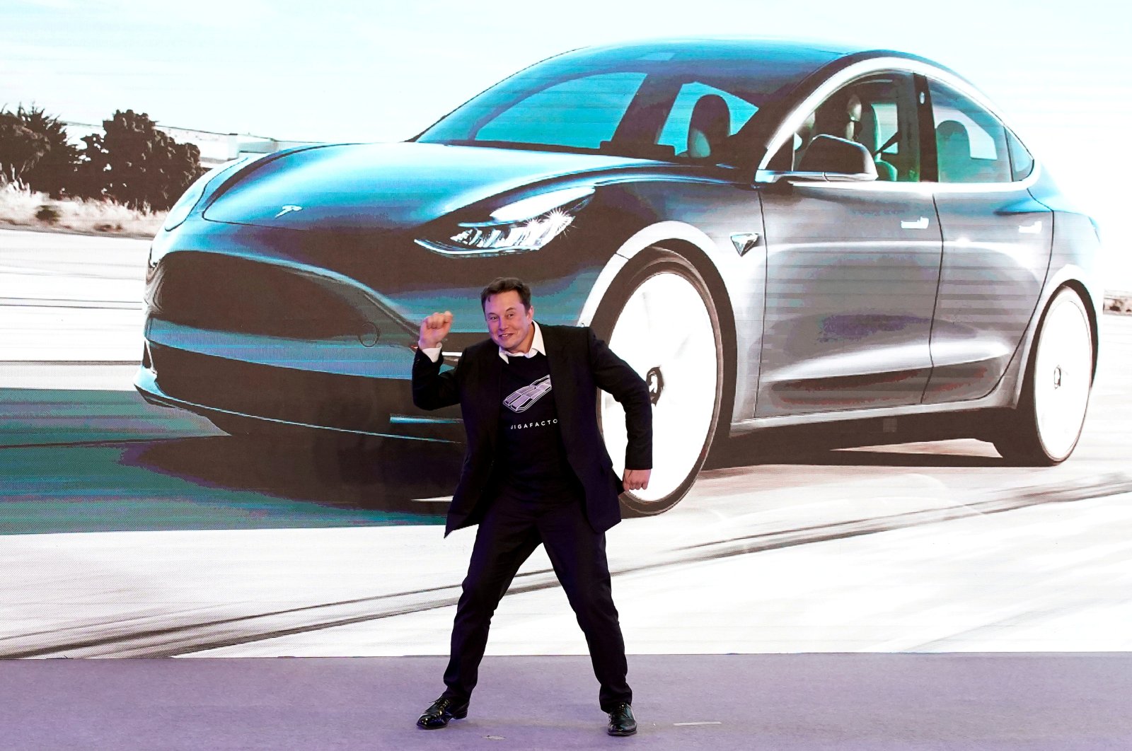 Tesla CEO Elon Musk dances onstage during a delivery event for Tesla China-made Model 3 cars in Shanghai, China, Jan. 7, 2020. (Reuters Photo)