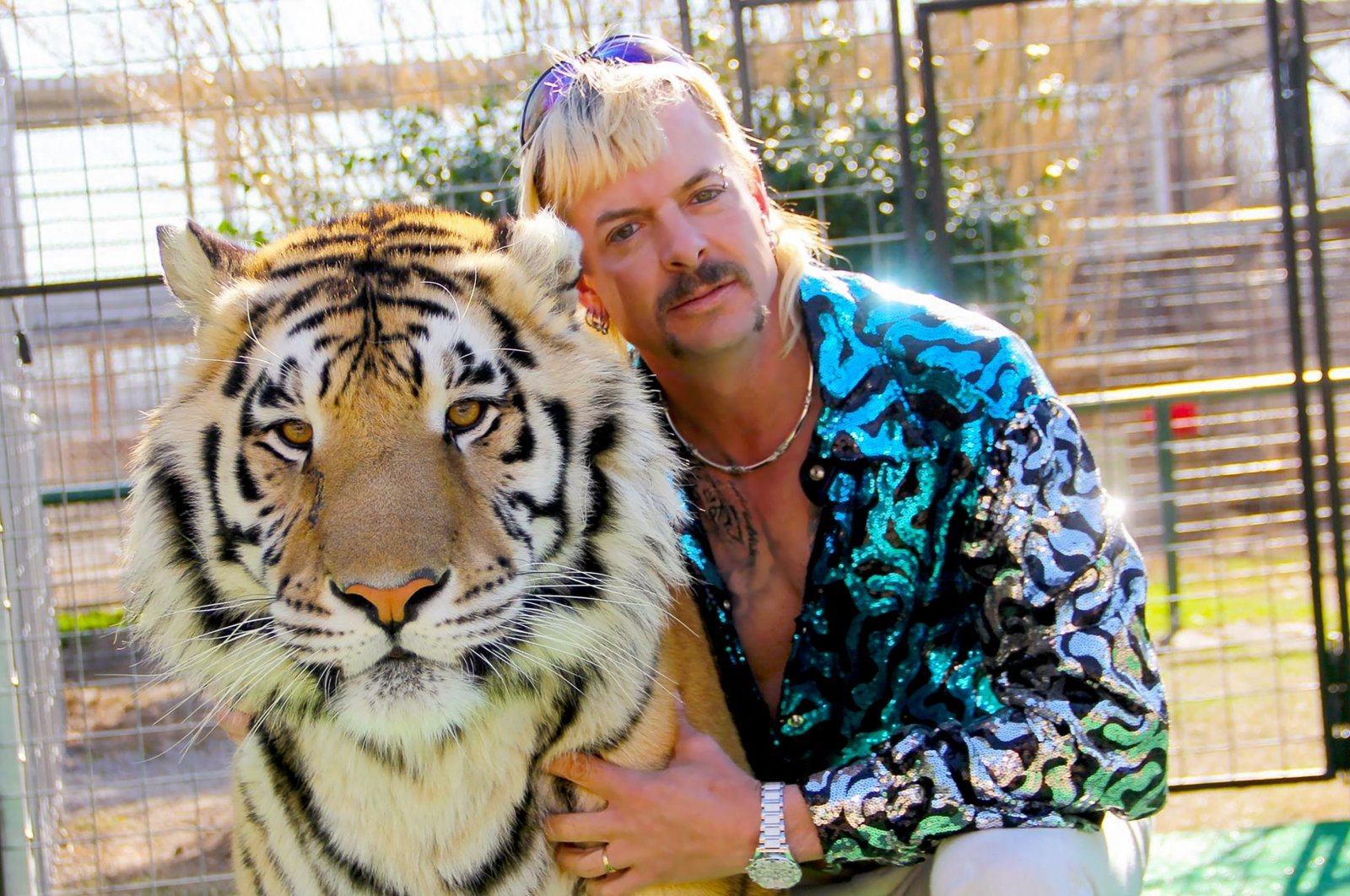 Joseph &quot;Joe Exotic&quot; Maldonado-Passage poses with one of his tigers, Jan. 20, 2020. (AFP File Photo via Netflix US) 