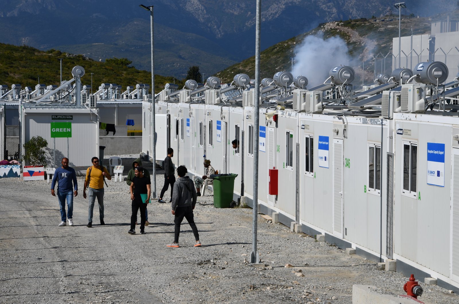 Migrants are evacuated from the closed camp for asylum-seekers on Samos island, Greece, Oct. 22, 2021. (EPA File Photo)