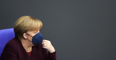 German Chancellor Angela Merkel attends a debate about the measures to battle COVID-19 at the Bundestag in Berlin, Germany, Nov. 11, 2021. (AP Photo)
