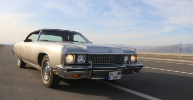 The 1973 Chevy Caprice Classic of classic car enthusiast Haluk Ertek seen on a highway in Erzurum, Turkey, Nov. 9, 2021 (IHA Photo)