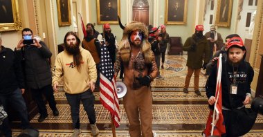 Supporters of U.S. President Donald Trump, including members of the QAnon conspiracy group Jacob Anthony Chansley, aka QAnon Shaman (C), enters the U.S. Capitol in Washington, D.C., Jan. 6, 2021. (AFP Photo)