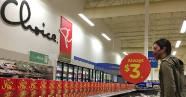A woman looks at frozen turkeys at a supermarket a few days before the Thanksgiving long weekend during the fourth wave of the novel coronavirus pandemic in Toronto, Ontario, Canada on Oct. 7, 2021. (Reuters File Photo)