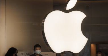 A man stands in front of the Apple shop in Shanghai, China, Nov. 10, 2021. (EPA Photo)